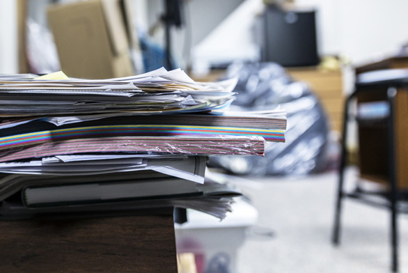 pile of documents for onsite confidential shredding